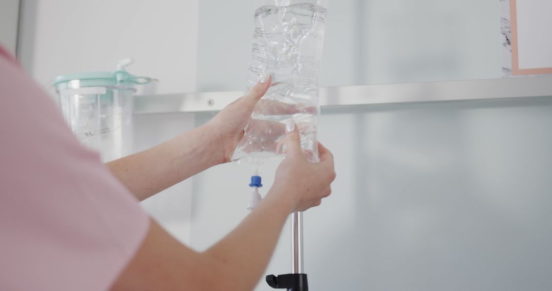 Nurse Preparing Intravenous Drip Equipment in Hospital - Free Images, Stock Photos and Pictures on Pikwizard.com