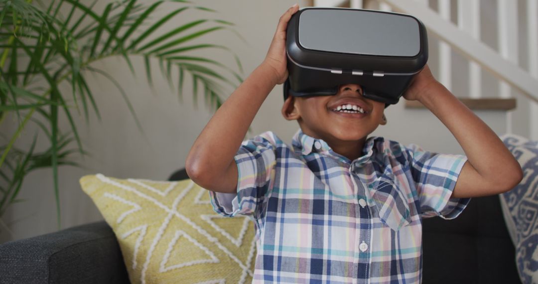 Excited Boy Experiencing Virtual Reality at Home