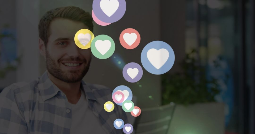 Man Interacting with Social Media Heart Icons at Home
