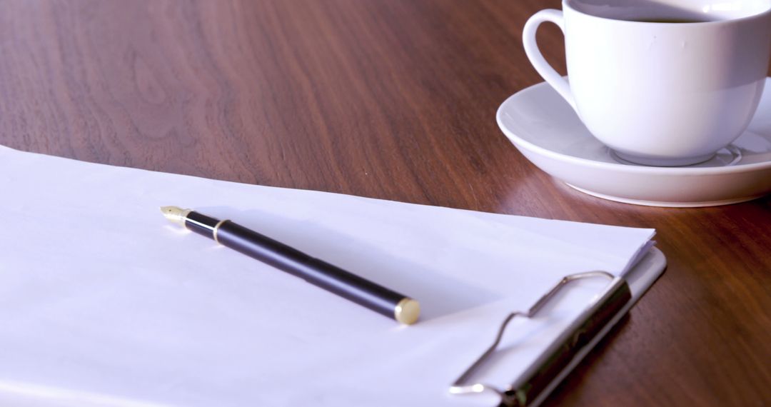 Clipboard Paper with Pen and Coffee Cup on Wooden Desk - Free Images, Stock Photos and Pictures on Pikwizard.com