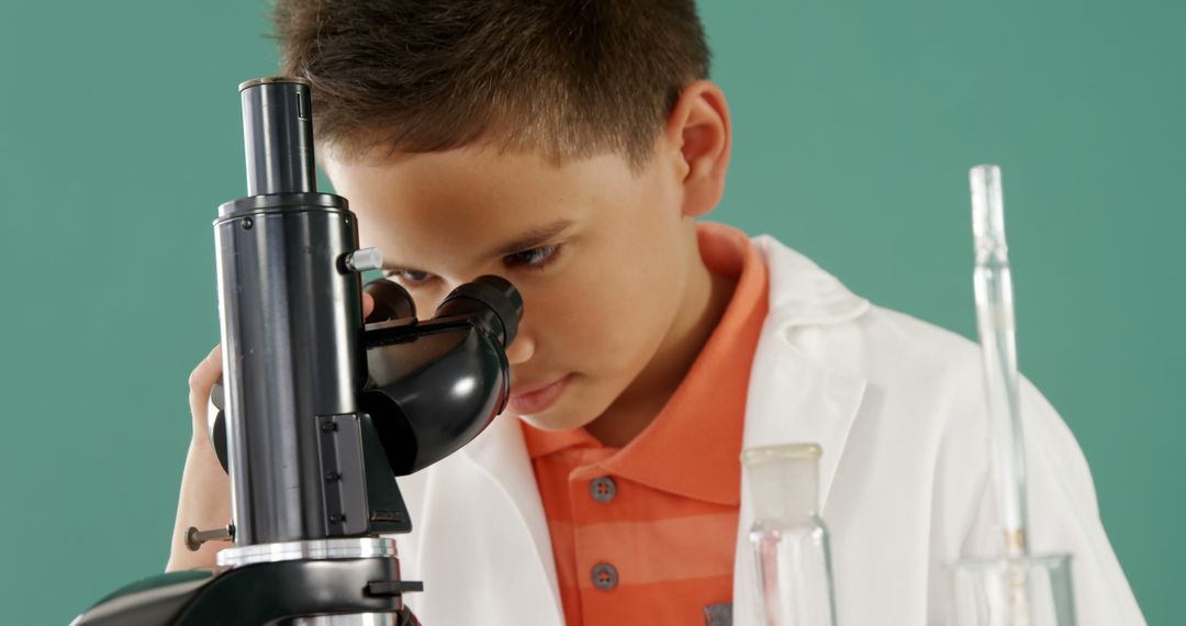 Young Boy Looking Through Microscope in Science Class - Free Images, Stock Photos and Pictures on Pikwizard.com