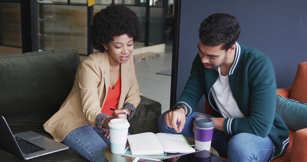 Colleagues Engaged in Collaborative Work in Office