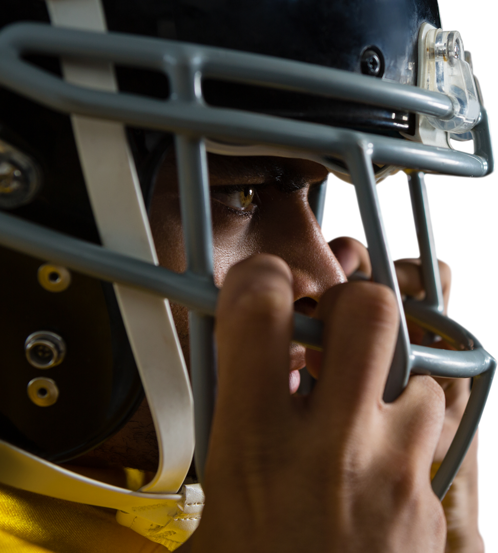 Close-up of confident American football player adjusting helmet, looking forward - Download Free Stock Images Pikwizard.com