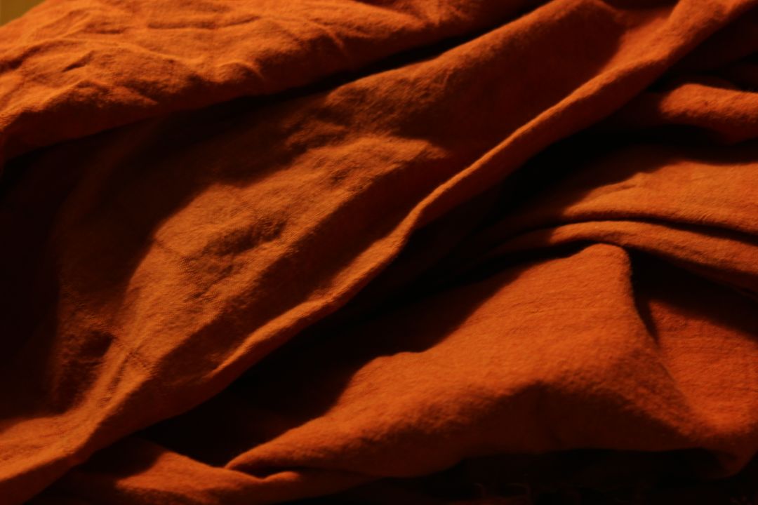 Close-Up of Wrinkled Fabric Texture in Warm Light - Free Images, Stock Photos and Pictures on Pikwizard.com