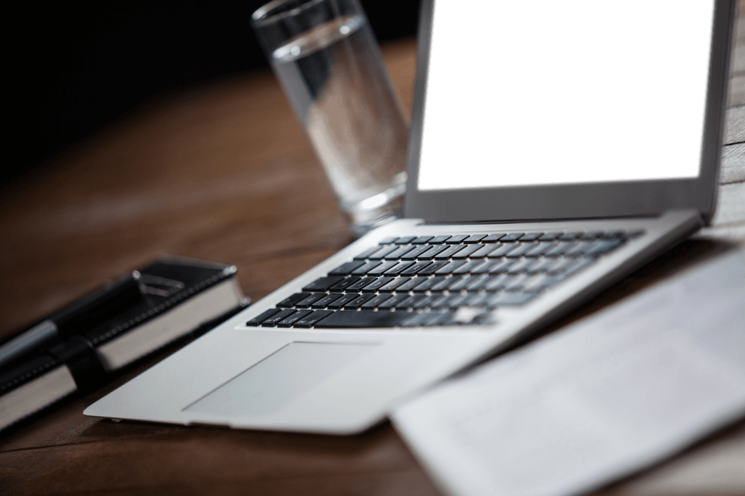 Transparent Laptop Screen with Water Glass on Wooden Table