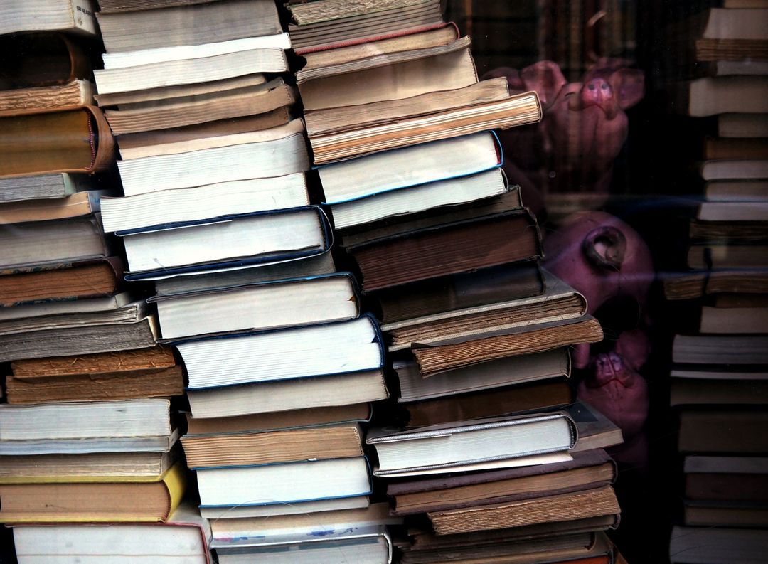 Leaning Stack of Vintage Books with Reflected Woman Face - Free Images, Stock Photos and Pictures on Pikwizard.com
