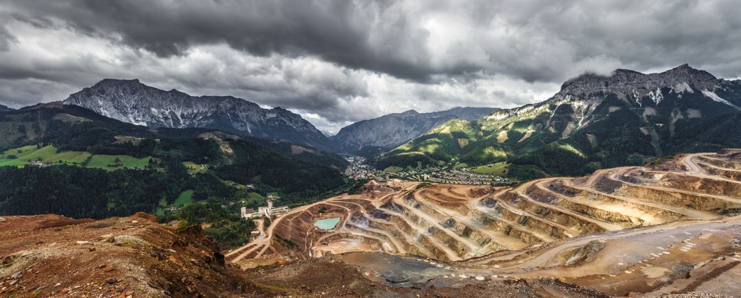 Dramatic Open-Pit Mine With Mountain Scenery - Free Images, Stock Photos and Pictures on Pikwizard.com