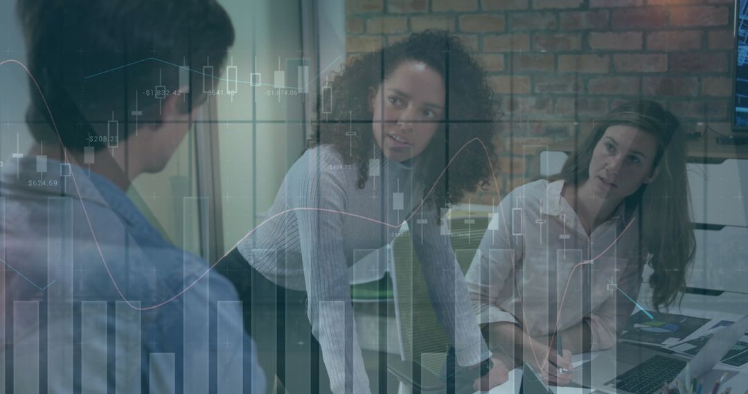 Business Team Analyzing Financial Charts in Modern Office Setting