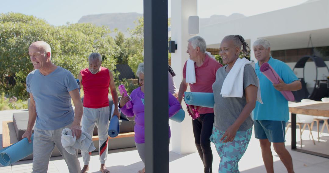 Active Seniors Enjoying Outdoor Yoga Session with Mats and Towels - Free Images, Stock Photos and Pictures on Pikwizard.com