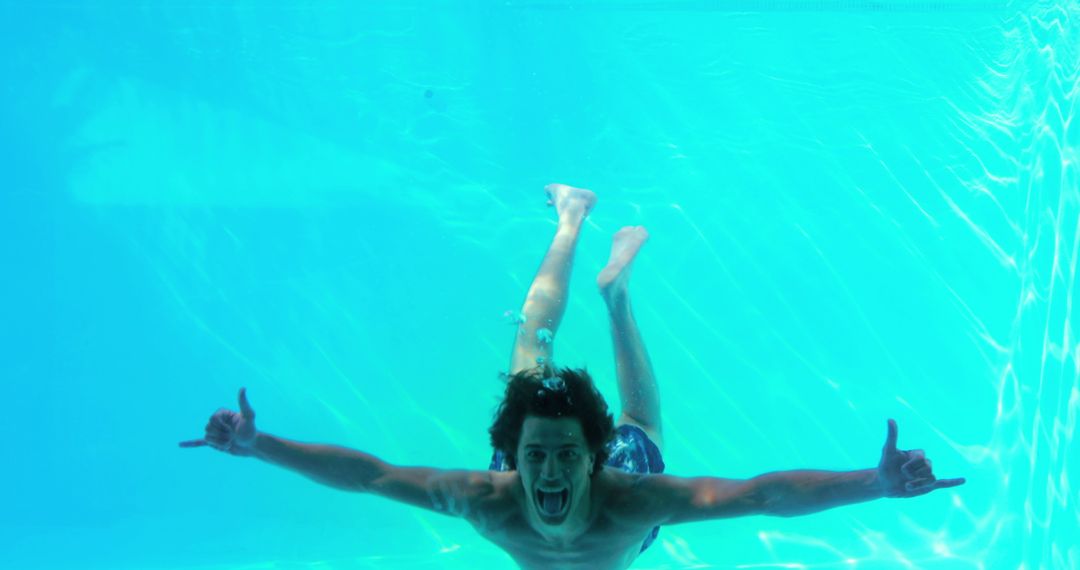 Carefree Man Enjoying Swimming Pool Dive and Chill Waves