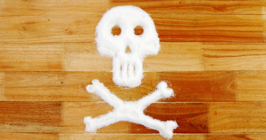 A sugar-crafted skull and crossbones warns of sugar's health risks. - Free Images, Stock Photos and Pictures on Pikwizard.com
