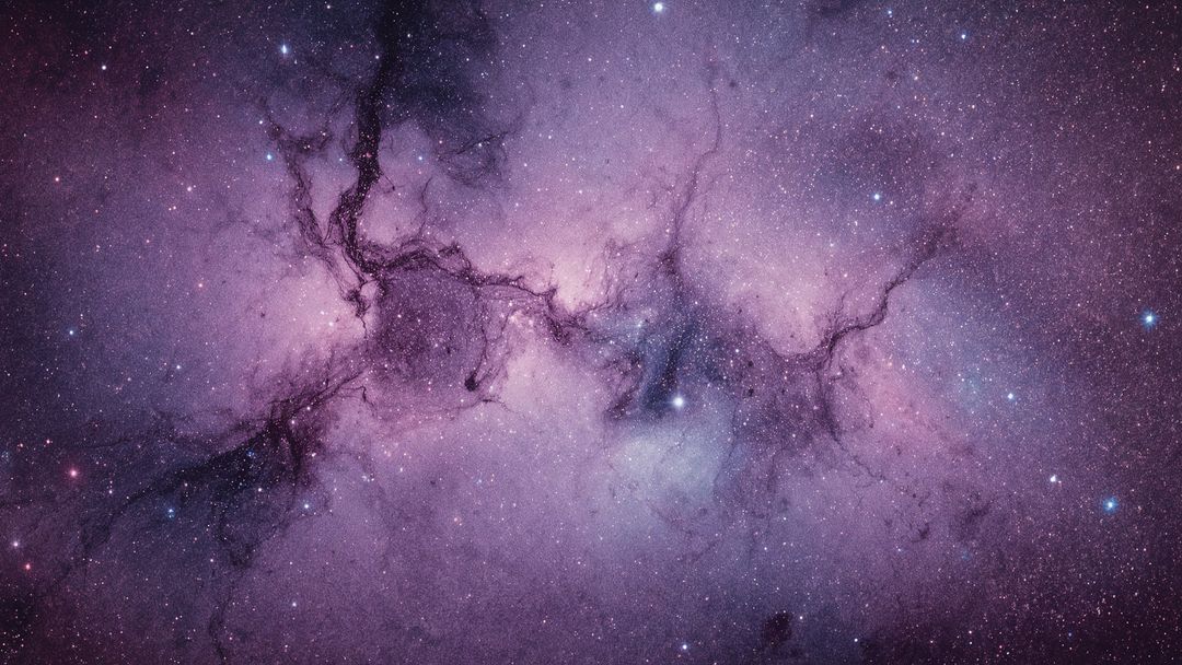 Vibrant Pink Emission Nebula with Stars and Dust Lanes in Deep Space