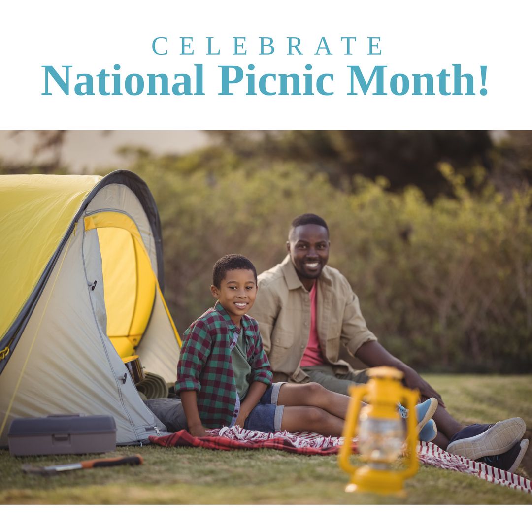 Father and Son Enjoying Picnic in Park with Tent