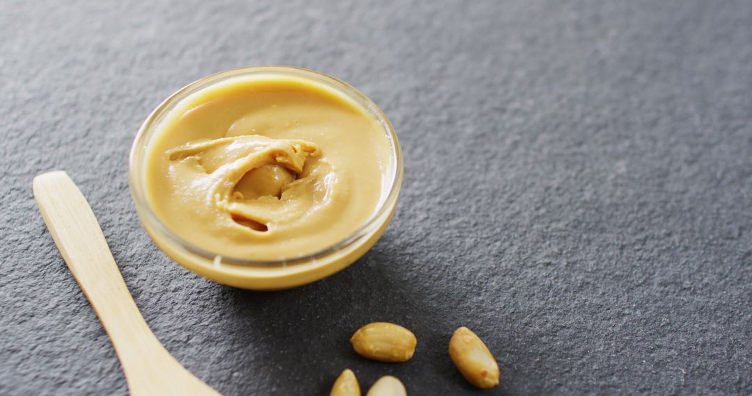 Close-up of Smooth Peanut Butter and Nuts on Slate Surface - Free Images, Stock Photos and Pictures on Pikwizard.com