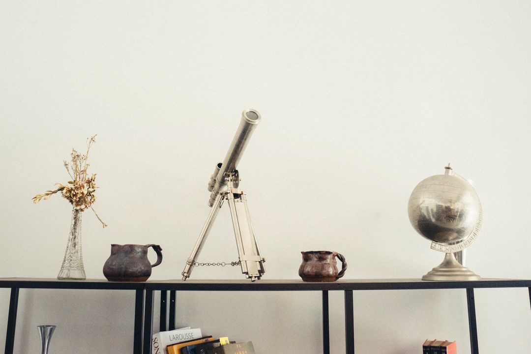 Minimalistic Decor with Telescope and Globe on Shelf - Free Images, Stock Photos and Pictures on Pikwizard.com