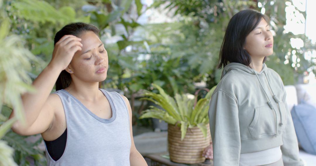 Two Women Meditating Outdoors in Nature - Free Images, Stock Photos and Pictures on Pikwizard.com