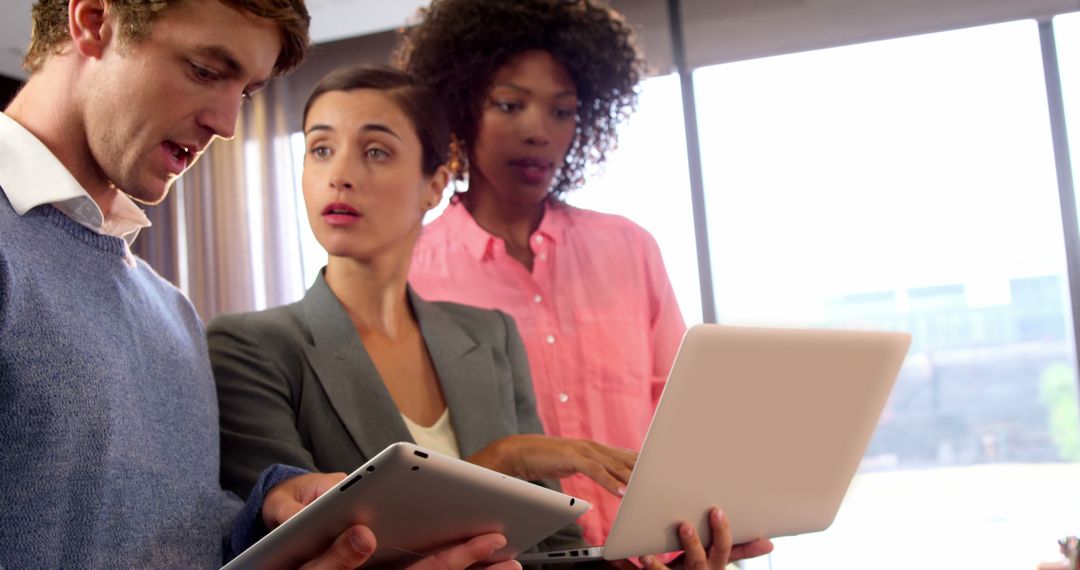 Diverse Business Professionals Collaborating with Technology