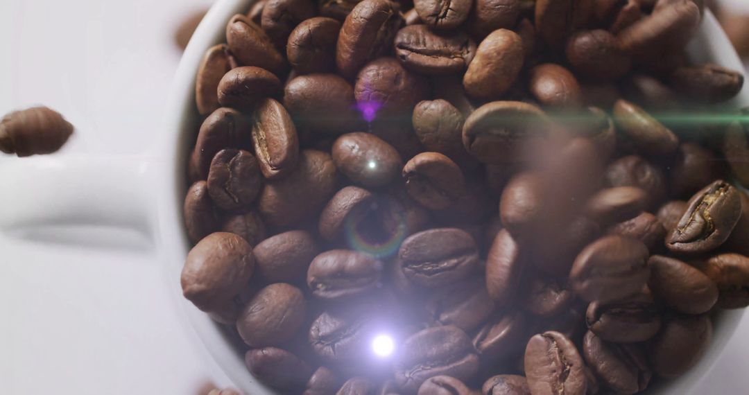 Falling Roasted Coffee Beans in White Mug with Flare