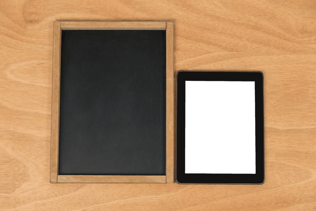 Transparent Tablet and Chalkboard on Wooden Surface