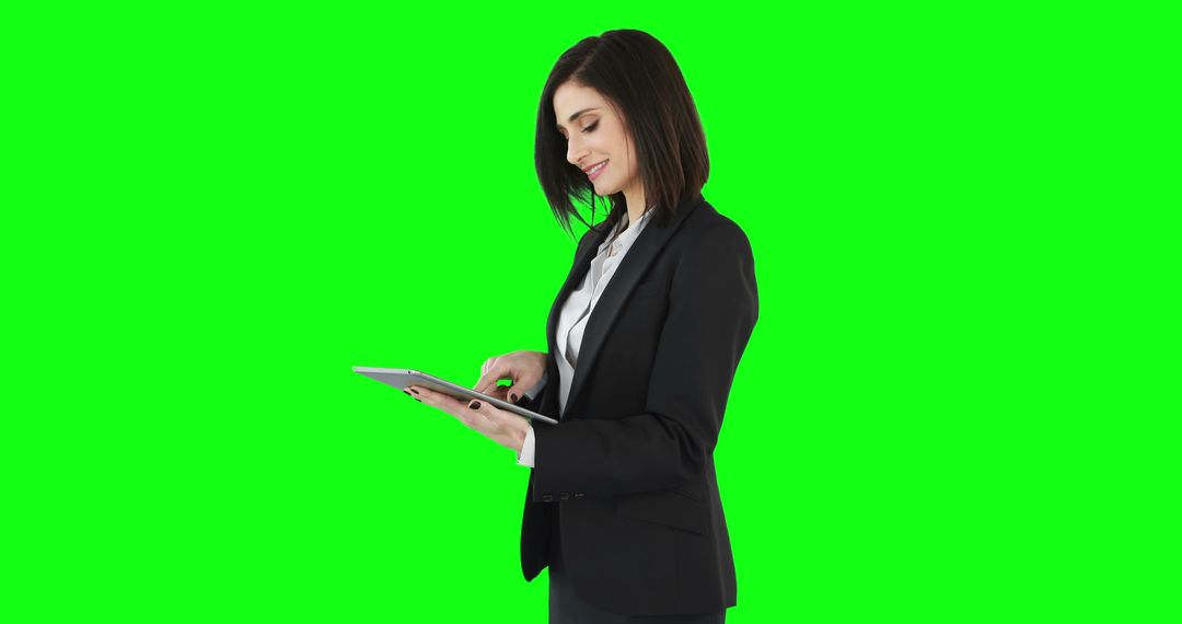 Businesswoman Using Tablet Device on Green Screen Background - Free Images, Stock Photos and Pictures on Pikwizard.com