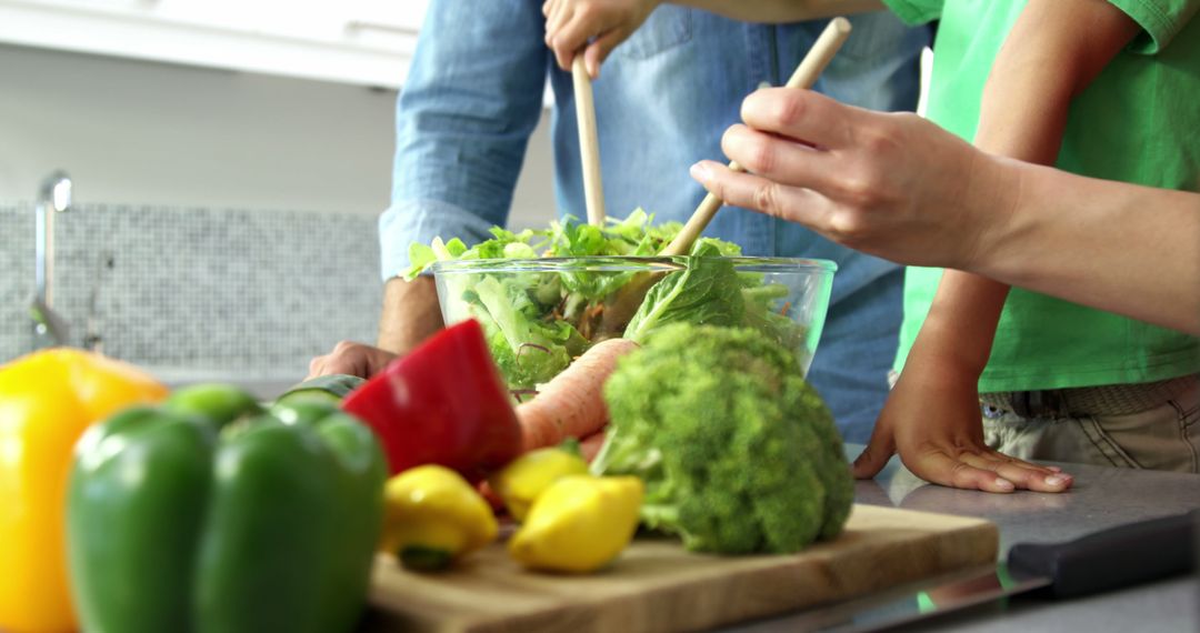 Family Preparing Salad Together in Modern Kitchen - Free Images, Stock Photos and Pictures on Pikwizard.com