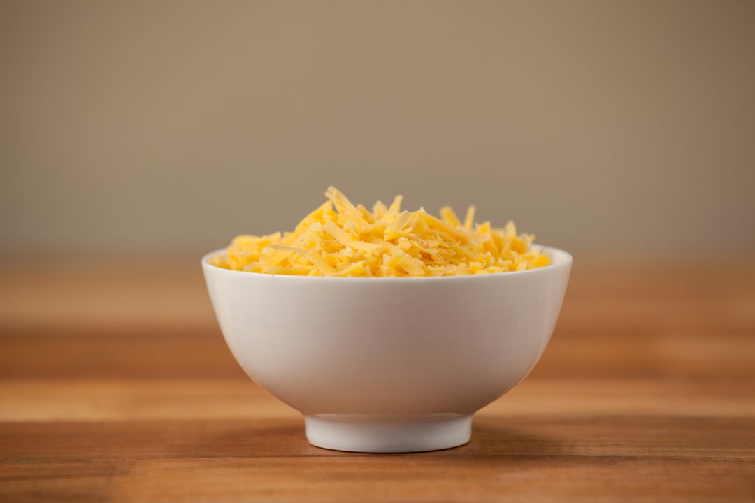 Grated cheese in a bowl - Free Images, Stock Photos and Pictures on Pikwizard.com