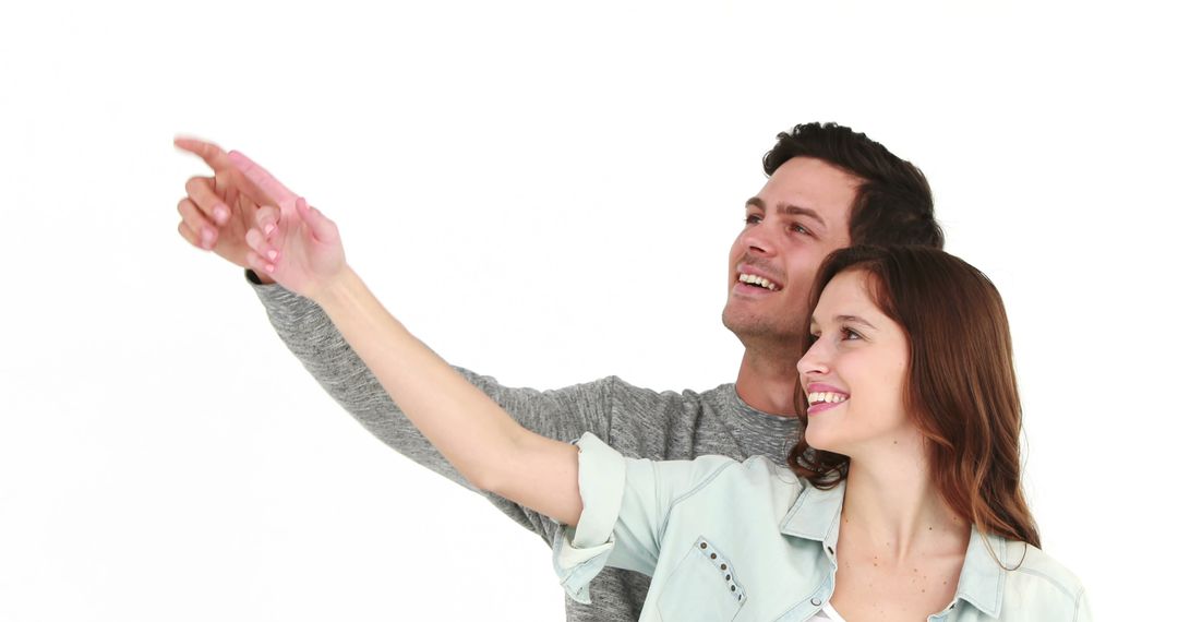 Happy Cheerful Couple Pointing with Excitement