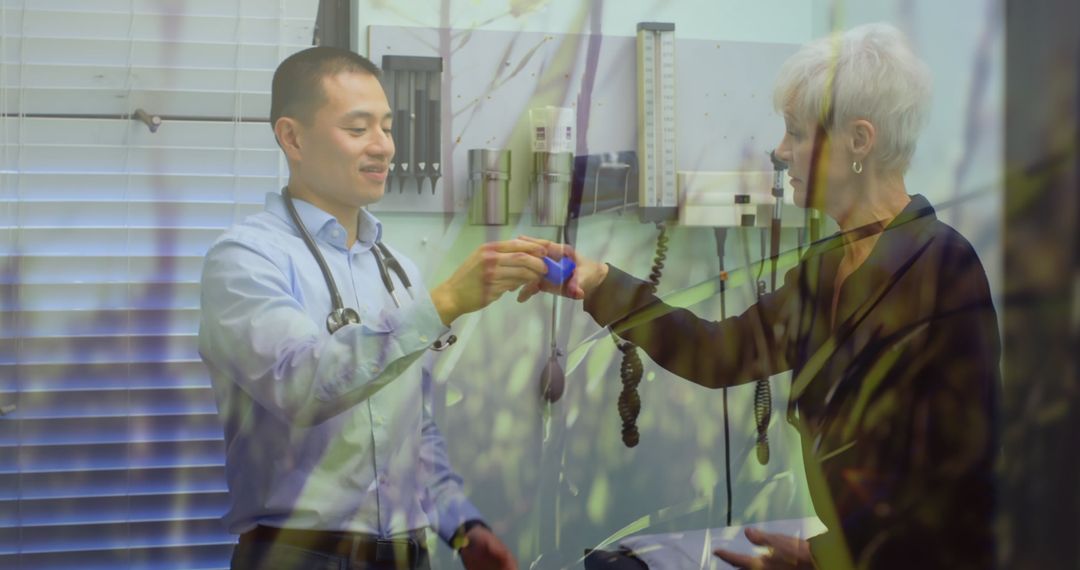 Doctor Assisting Senior Patient with Inhaler in Healthcare Setting