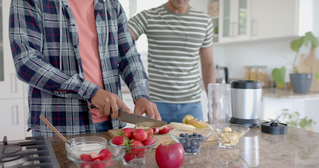 Two People Preparing Fruits in Modern Kitchen for Healthy Smoothie - Free Images, Stock Photos and Pictures on Pikwizard.com