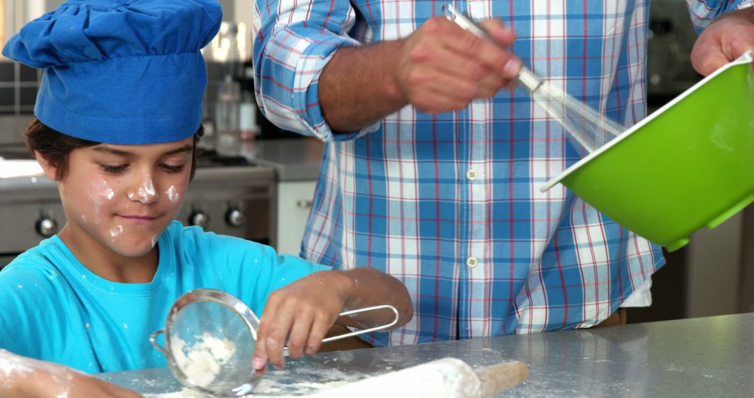 Father and Son Enjoying Fun Baking Activity in Kitchen - Free Images, Stock Photos and Pictures on Pikwizard.com