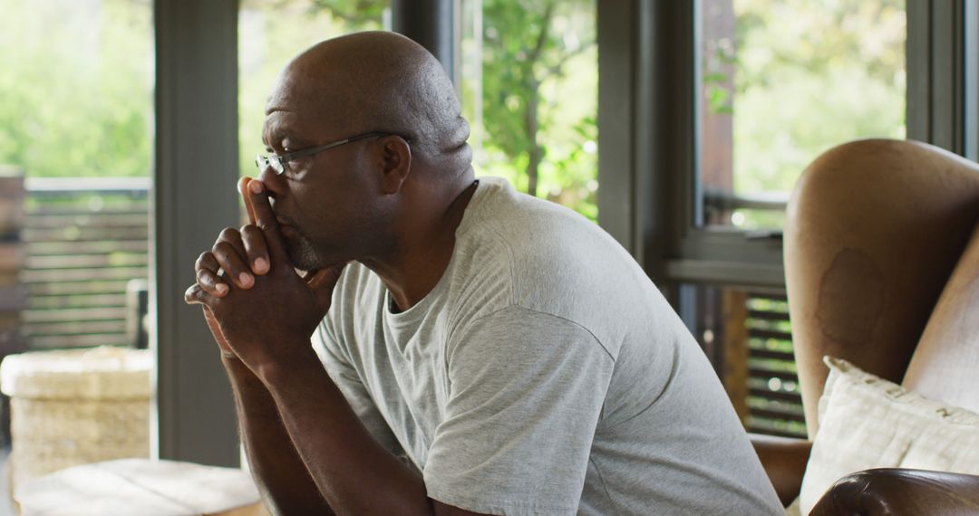 Thoughtful Senior Man Contemplating in Home Setting