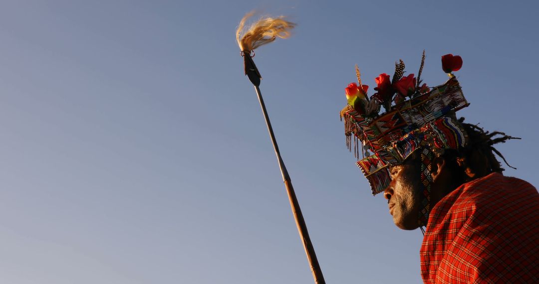 Maasai Warrior in Traditional Dress Holding Spear at Sunset - Free Images, Stock Photos and Pictures on Pikwizard.com