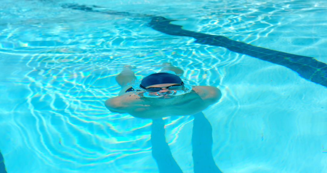 Child Swimming Underwater in Pool - Free Images, Stock Photos and Pictures on Pikwizard.com