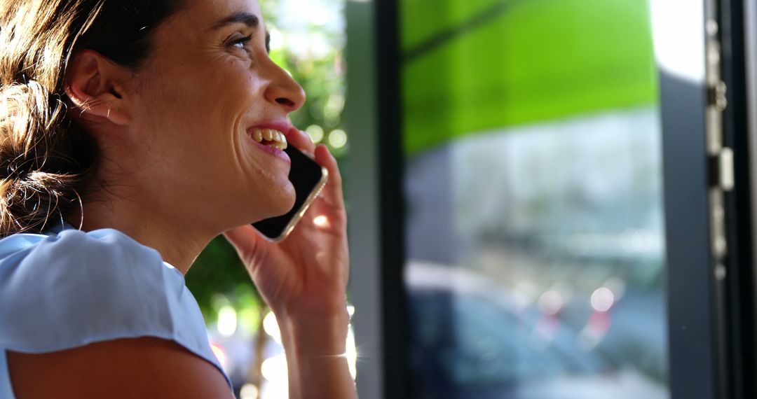 Woman Smiling and Talking on Phone Close-Up - Free Images, Stock Photos and Pictures on Pikwizard.com