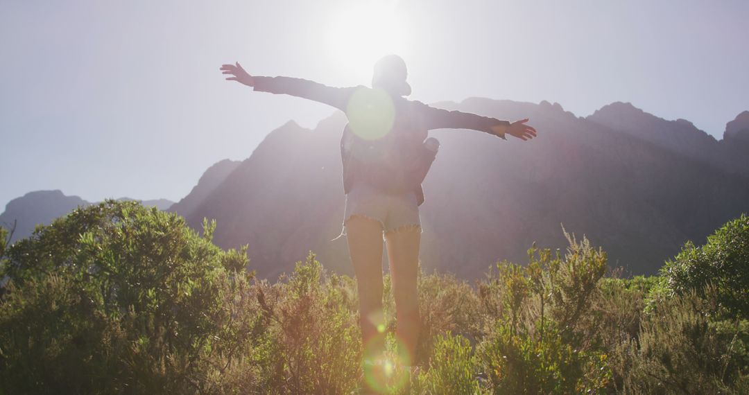 Couple Embracing Nature with Backdrop of Mountain at Sunset - Free Images, Stock Photos and Pictures on Pikwizard.com