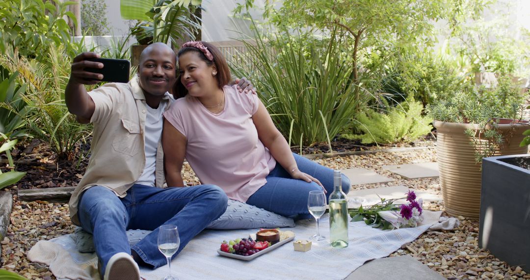 Relaxed Couple Enjoying Romantic Picnic in Lush Garden Setting