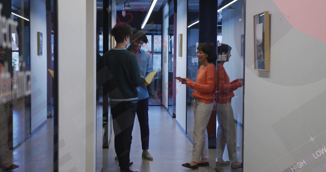 Coworkers Analyzing Report in Modern Business Corridor