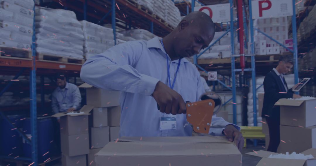 Warehouse Worker Using Tape Dispenser for Packing
