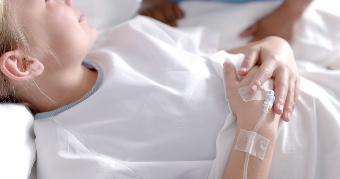 Close-up of Young Patient with IV Drip in Hospital Bed - Free Images, Stock Photos and Pictures on Pikwizard.com