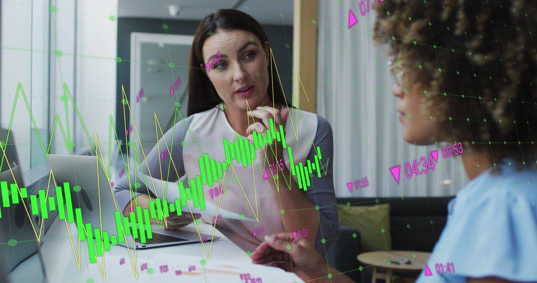 Diverse Coworkers Discussing Financial Growth with Digital Graphs