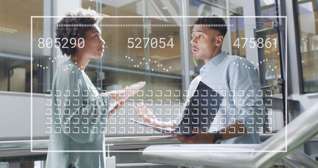 Colleagues Discussing Data Integration at Modern Office