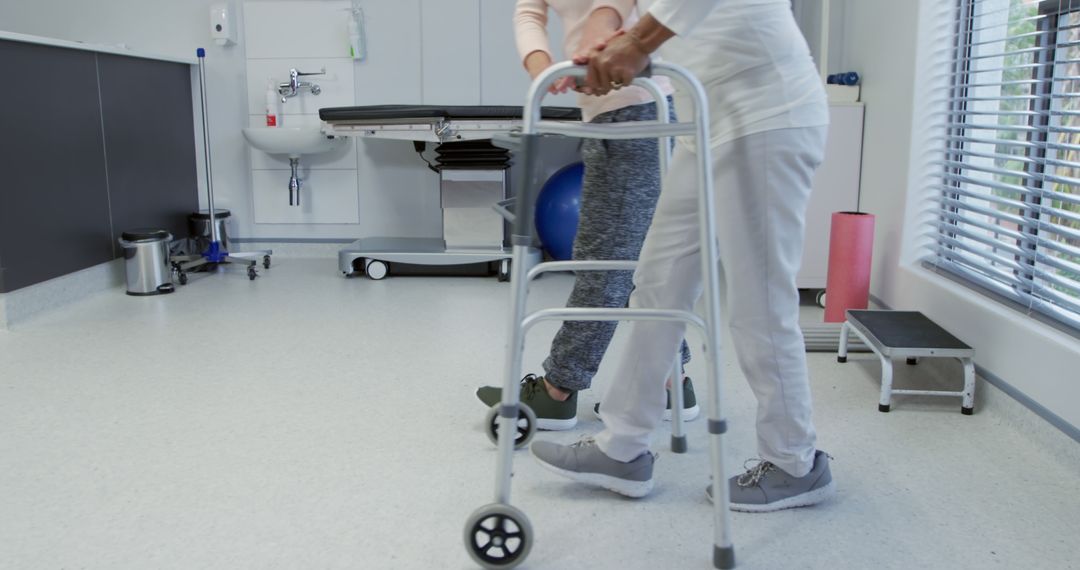 Healthcare Worker Assisting Elderly Patient with Walker in Rehabilitation Facility - Free Images, Stock Photos and Pictures on Pikwizard.com