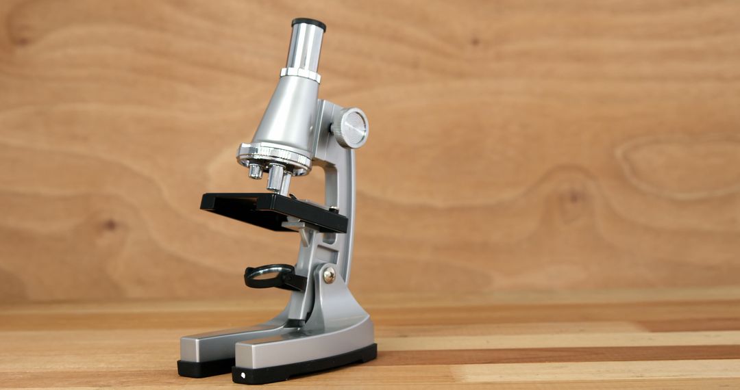 Microscope on wooden table for scientific research - Free Images, Stock Photos and Pictures on Pikwizard.com