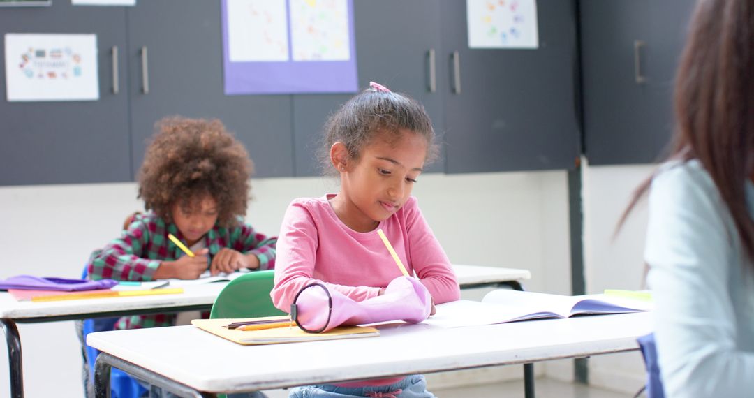 Focused Students Writing in Classroom for Effective Learning