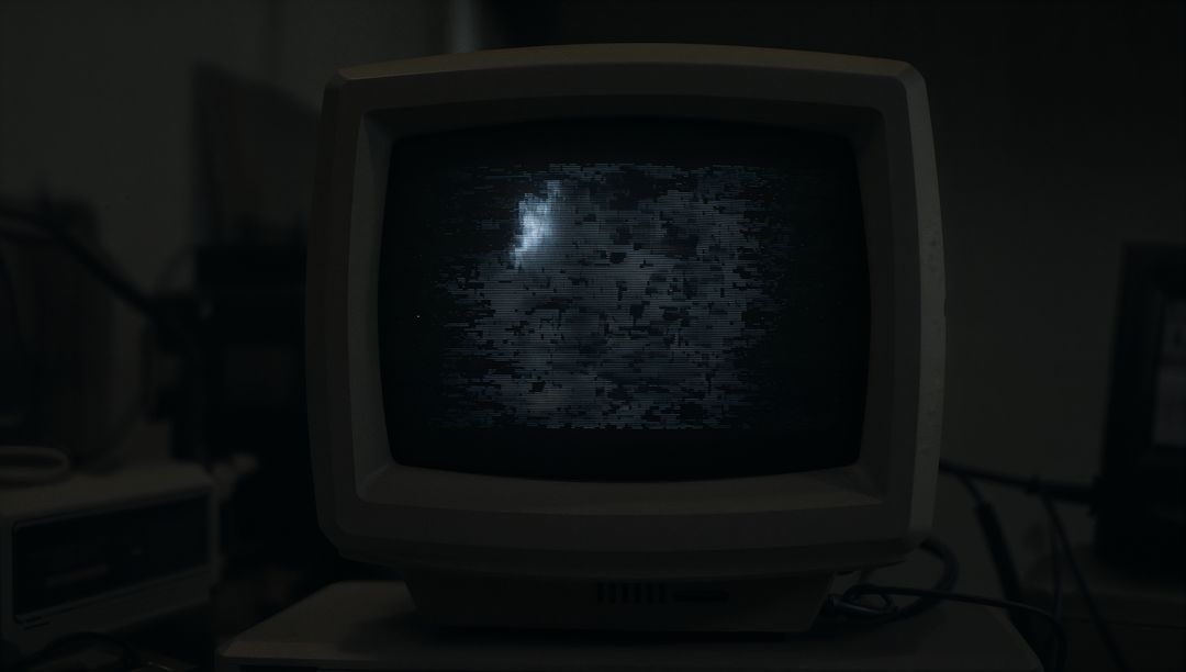 Vintage CRT Monitor with Static Screen in Retro Basement