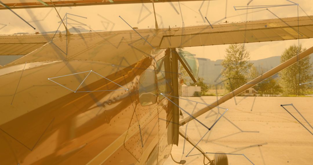 Gleaming small aircraft fuselage on airport ramp with translucent geometric overlay
