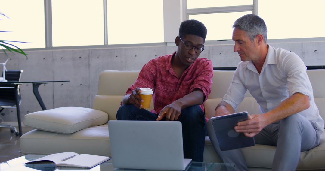 Diverse Assistants Collaborating with Coffee and Technology in Urban Office