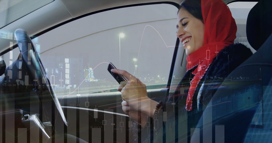 Smiling Woman in Hijab Texting in Car with Digital Graph Overlay