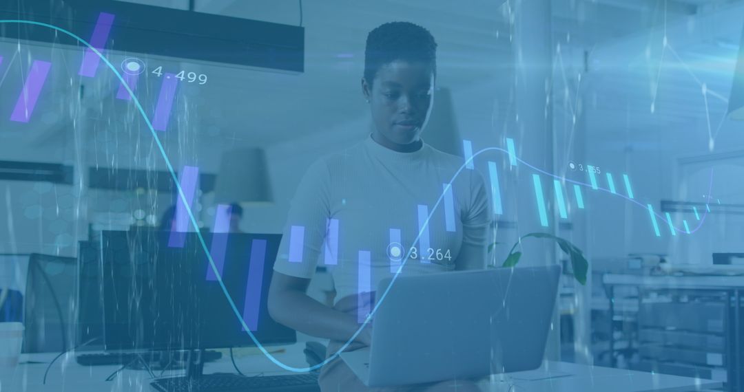 Business Analyst Using Laptop with Financial Data Overlay