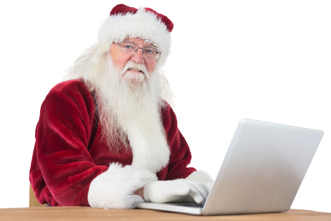 Santa Claus using laptop with cheerful expression and transparent background - Download Free Stock Images Pikwizard.com